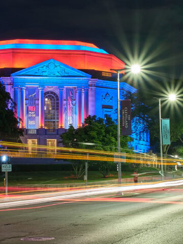 Severance Hall at night with traffic trails
