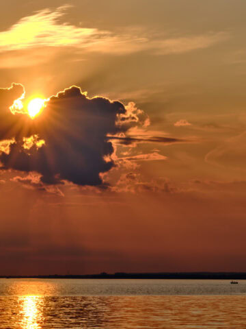 Sun breaking through the clouds over Lake Erie from Lakewood Park